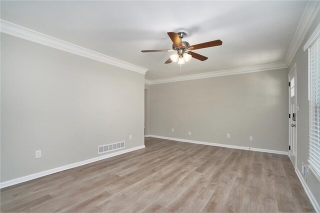 2434 Miriam Ln, Decatur, GA 30032 - spare room with visible vents, ornamental molding, light wood-style floors, and ceiling fan