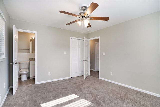 2434 Miriam Ln, Decatur, GA 30032 - unfurnished bedroom with a closet, carpet flooring, connected bathroom, and baseboards