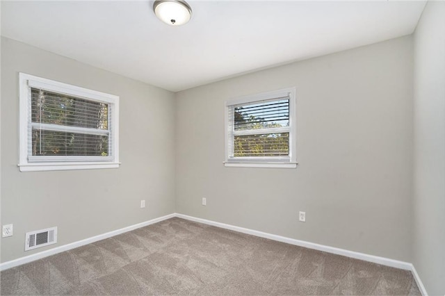 2434 Miriam Ln, Decatur, GA 30032 - empty room with visible vents, carpet flooring, and baseboards