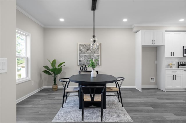 dining room featuring dark wood-type flooring, recessed lighting, crown molding, and baseboards