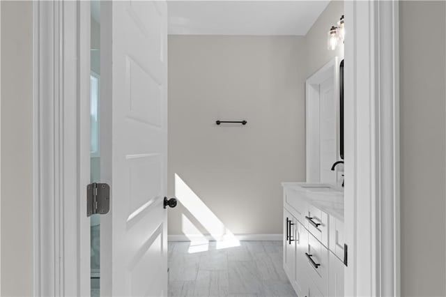 bathroom featuring vanity and baseboards