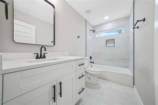 full bathroom featuring toilet, vanity, visible vents, marble finish floor, and washtub / shower combination