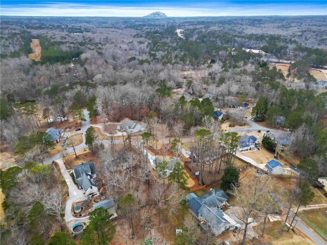 drone / aerial view featuring a forest view