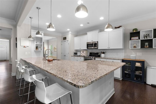 17 Twelve Oaks Dr SE, Cartersville, GA 30120 - kitchen with stainless steel appliances, open shelves, a sink, dark wood-type flooring, and crown molding