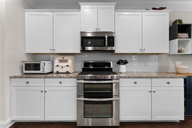 17 Twelve Oaks Dr SE, Cartersville, GA 30120 - kitchen featuring appliances with stainless steel finishes, white cabinets, light stone counters, tasteful backsplash, and crown molding