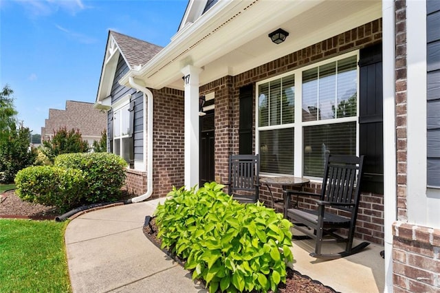 17 Twelve Oaks Dr SE, Cartersville, GA 30120 - property entrance with a porch, brick siding, and a shingled roof