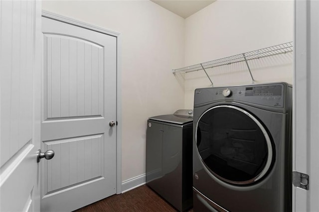 17 Twelve Oaks Dr SE, Cartersville, GA 30120 - washroom featuring washer and dryer, dark wood-style flooring, and baseboards