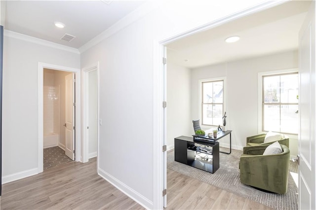 hall with recessed lighting, wood finished floors, visible vents, baseboards, and ornamental molding