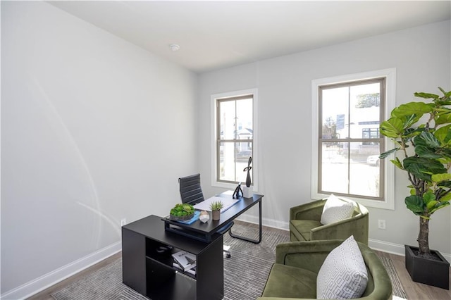 home office featuring dark wood-type flooring and baseboards