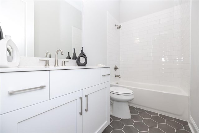 full bath with vanity, bathing tub / shower combination, tile patterned flooring, and toilet