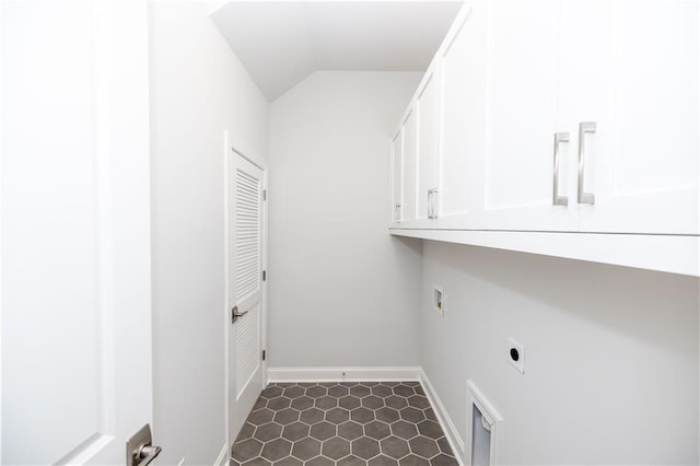 laundry room with cabinet space, electric dryer hookup, and baseboards