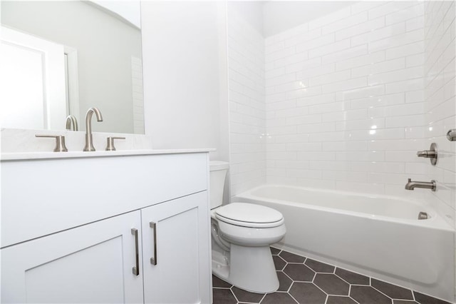 bathroom featuring toilet, tile patterned floors, tub / shower combination, and vanity