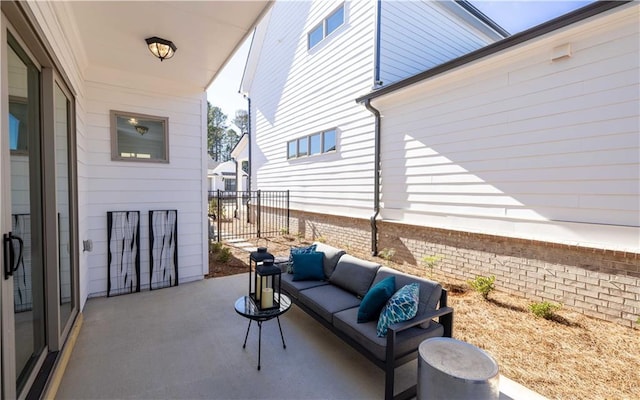 view of patio / terrace with fence and an outdoor living space