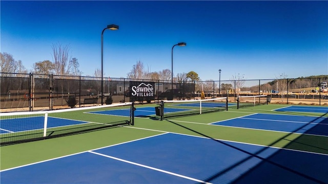 view of sport court with community basketball court and fence