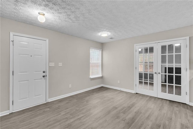 7185 Sweet Gum Ct, Lithonia, GA 30058 - unfurnished room with wood finished floors, baseboards, and a wealth of natural light