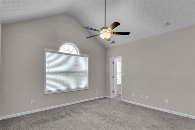 7185 Sweet Gum Ct, Lithonia, GA 30058 - unfurnished room featuring baseboards, ceiling fan, a textured ceiling, carpet flooring, and lofted ceiling