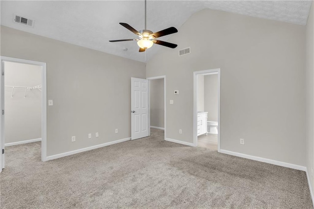 7185 Sweet Gum Ct, Lithonia, GA 30058 - unfurnished bedroom with a spacious closet, carpet, visible vents, and baseboards