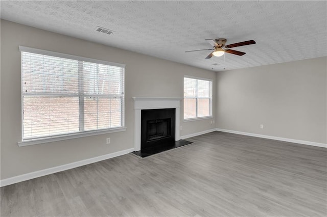 7185 Sweet Gum Ct, Lithonia, GA 30058 - unfurnished living room with wood finished floors, baseboards, a ceiling fan, and visible vents