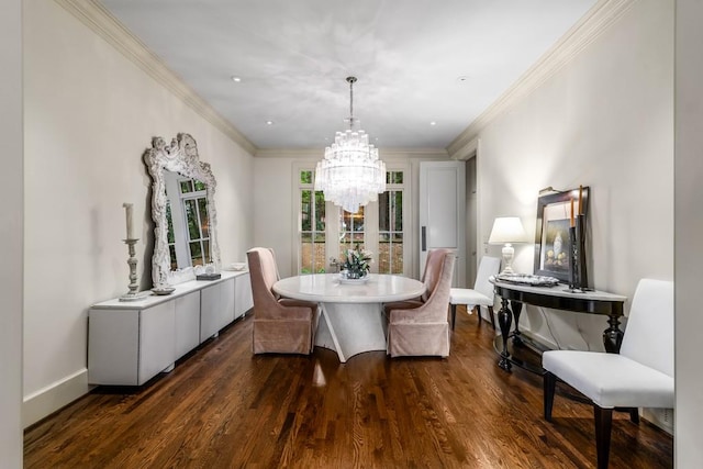 dining room with dark hardwood / wood-style flooring, crown molding, and a notable chandelier