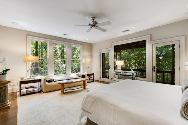 bedroom with access to outside, ceiling fan, and wood-type flooring