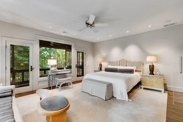 bedroom featuring hardwood / wood-style floors, ceiling fan, access to outside, and french doors