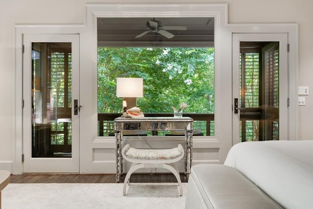 bedroom featuring multiple windows and hardwood / wood-style flooring