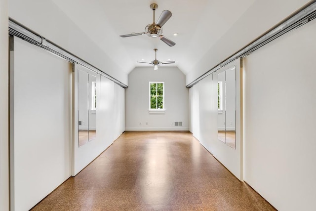 additional living space with vaulted ceiling and ceiling fan