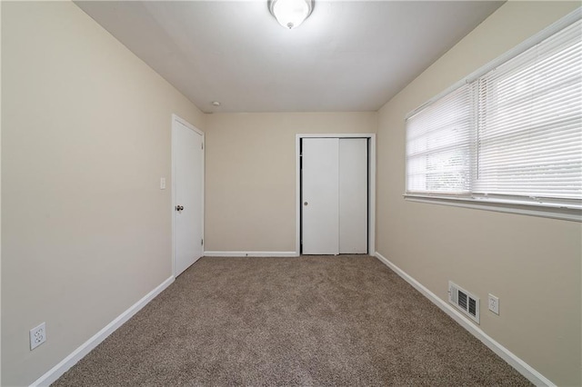 2104 Barbara Ln, Decatur, GA 30032 - unfurnished bedroom with a closet and carpet