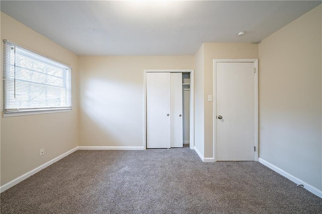 2104 Barbara Ln, Decatur, GA 30032 - unfurnished bedroom featuring carpet floors and a closet