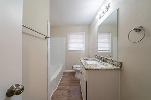 2104 Barbara Ln, Decatur, GA 30032 - full bathroom with vanity, shower / bathing tub combination, hardwood / wood-style flooring, and toilet