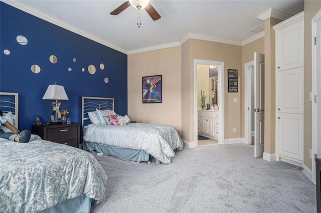 bedroom with an accent wall, carpet flooring, a ceiling fan, baseboards, and ornamental molding