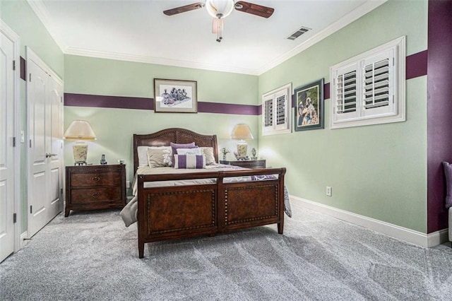 bedroom with carpet floors, visible vents, ornamental molding, ceiling fan, and baseboards