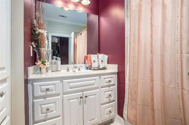 bathroom featuring visible vents and vanity