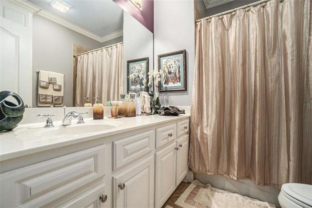 full bathroom featuring vanity, toilet, and crown molding