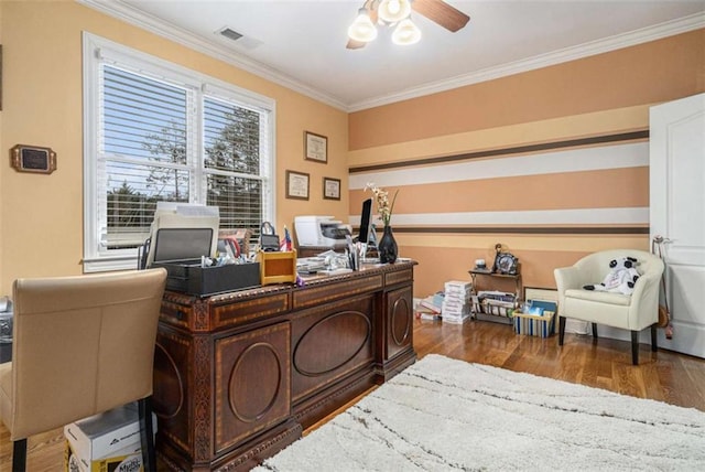 office area with visible vents, a ceiling fan, crown molding, and wood finished floors