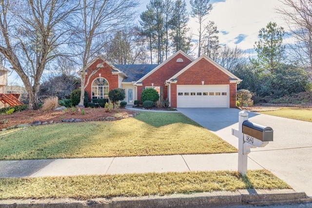 ranch-style house featuring a front yard and a garage