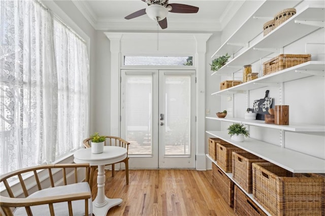 interior space with ceiling fan and french doors