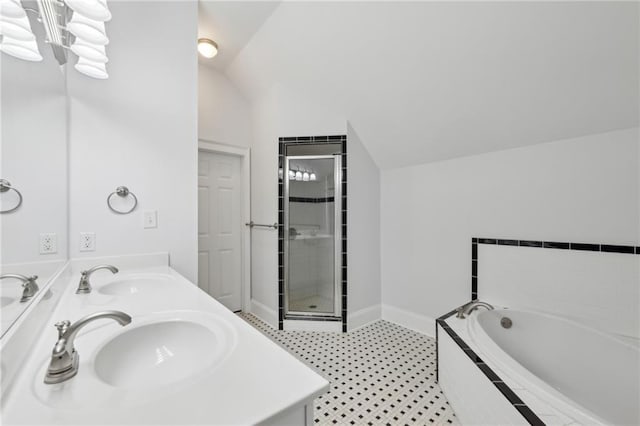 bathroom with lofted ceiling, shower with separate bathtub, and vanity