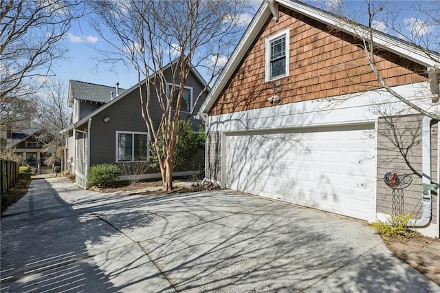 view of side of property featuring a garage