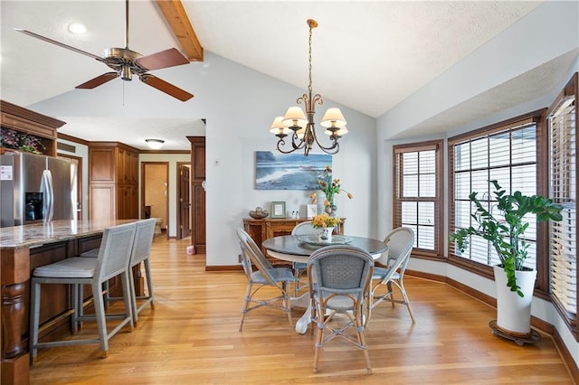 dining space with baseboards, vaulted ceiling with beams, light wood finished floors, and ceiling fan with notable chandelier