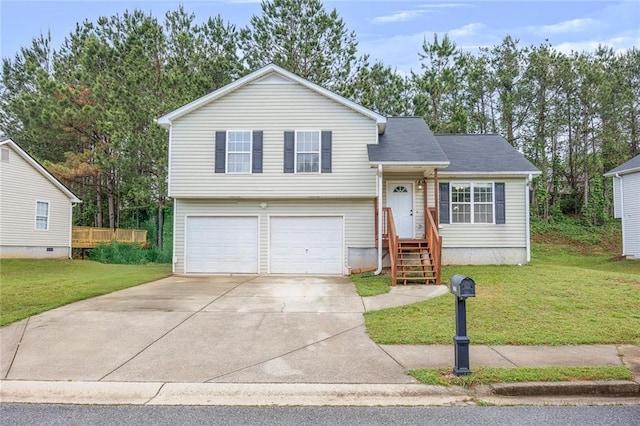 split level home featuring a garage, a shingled roof, driveway, and a front yard