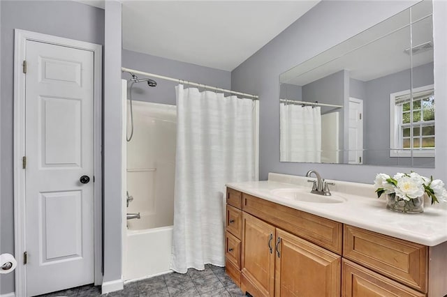 bathroom featuring vanity, shower / tub combo with curtain, and visible vents
