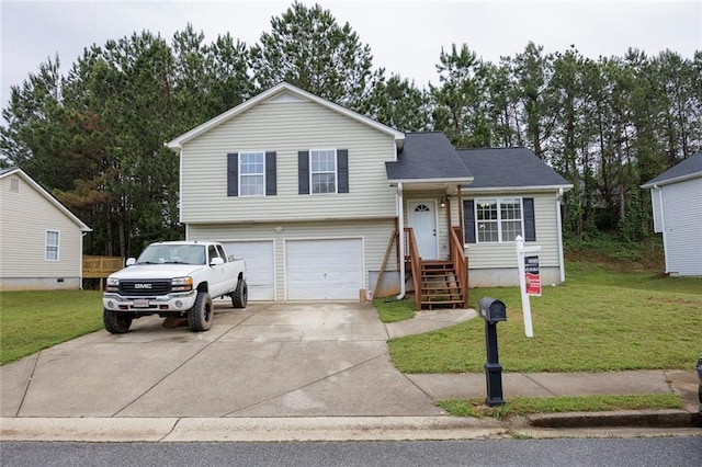split level home with an attached garage, driveway, and a front yard