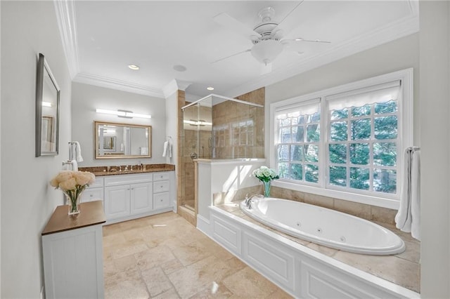 full bathroom with vanity, a ceiling fan, a whirlpool tub, a shower stall, and crown molding