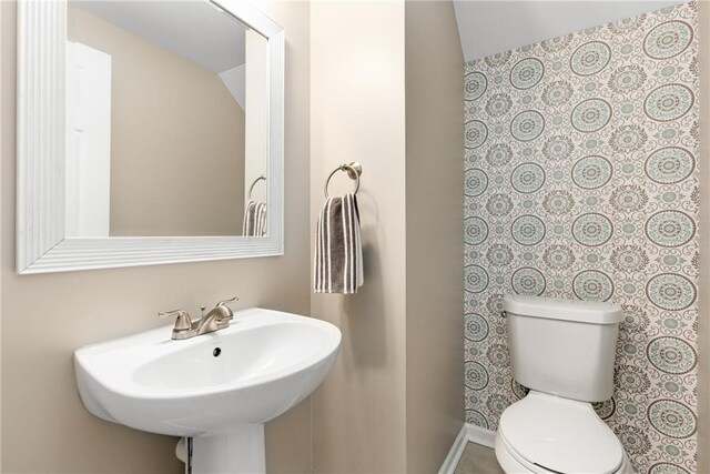 bathroom featuring sink and toilet