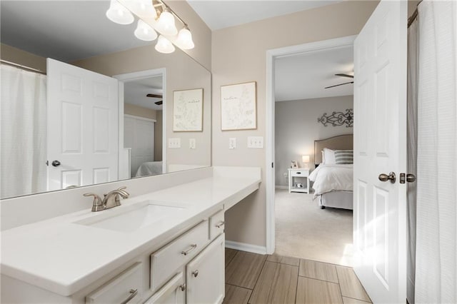 bathroom with ceiling fan and vanity