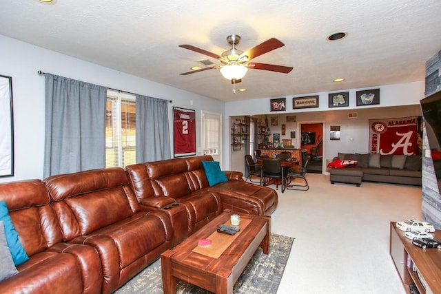 living room with light carpet, a textured ceiling, a ceiling fan, and recessed lighting