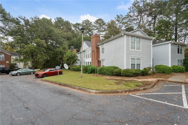 4315 Orchard Park Ct, Stone Mountain, GA 30083 - view of front facade with a front yard and uncovered parking