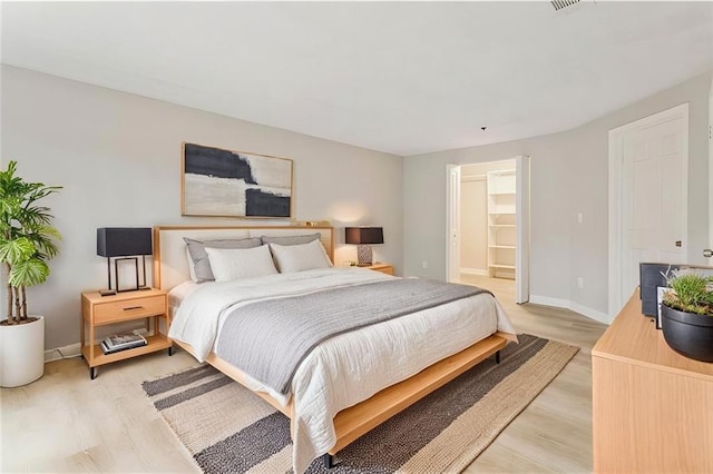 4315 Orchard Park Ct, Stone Mountain, GA 30083 - bedroom with light wood-style floors and baseboards