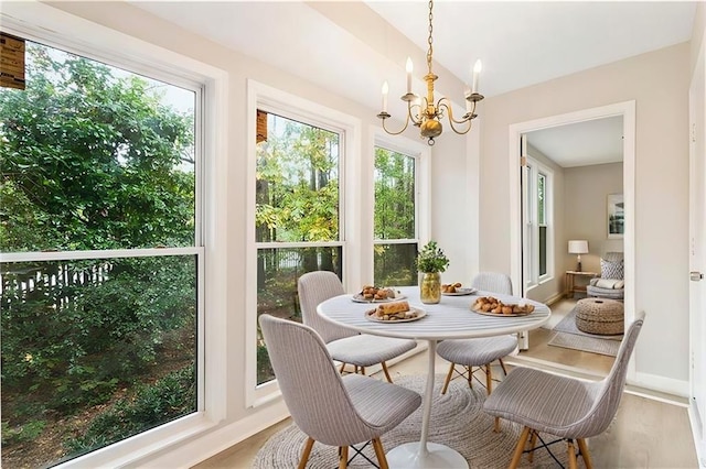 sunroom with a notable chandelier